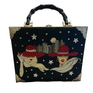 Red hat ladies cigar box tote with latch hook and gingham pattern inside.